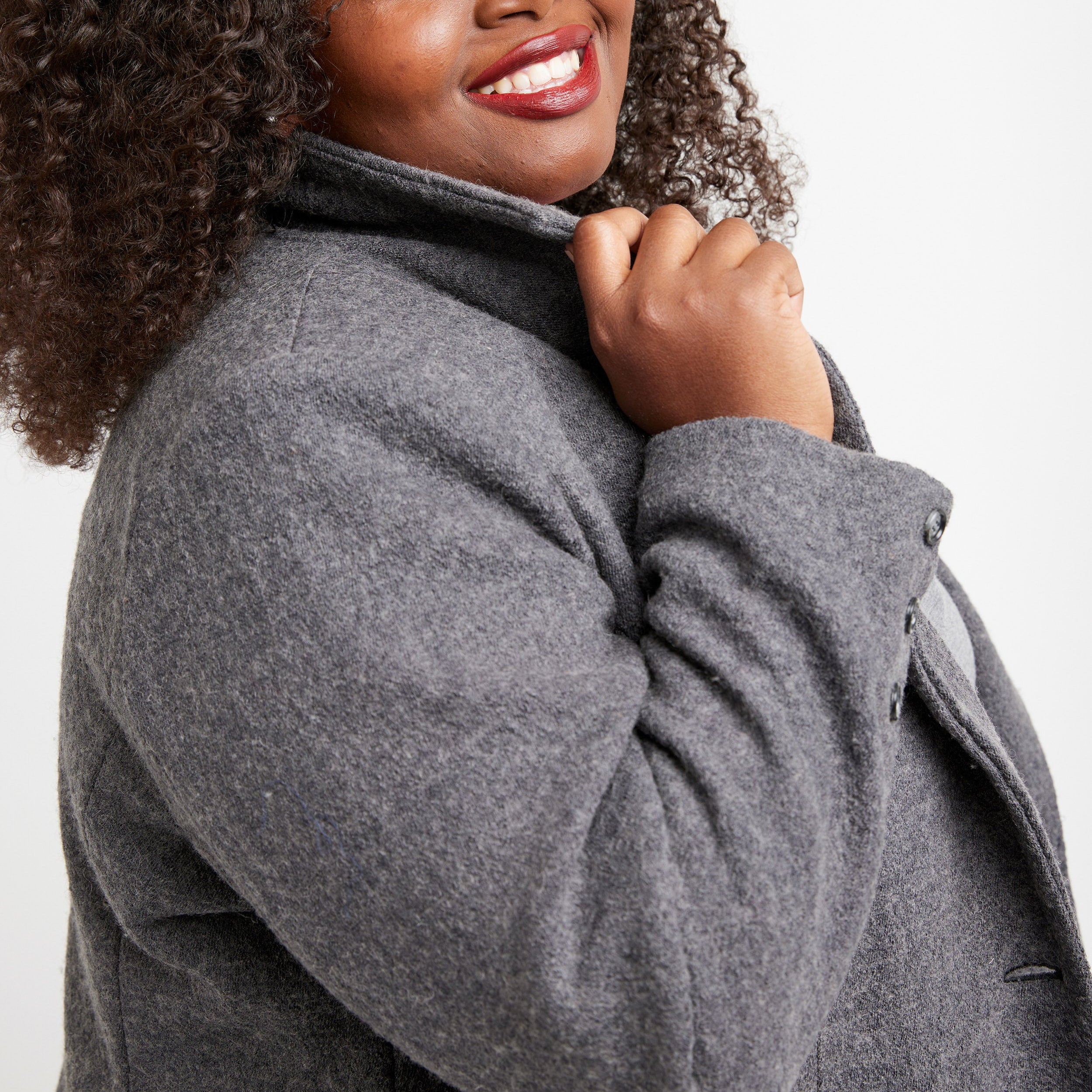 Woman wearing a gray coat against a white background. This blazer is the Auburn Blazer sewing pattern from Cashmerette.