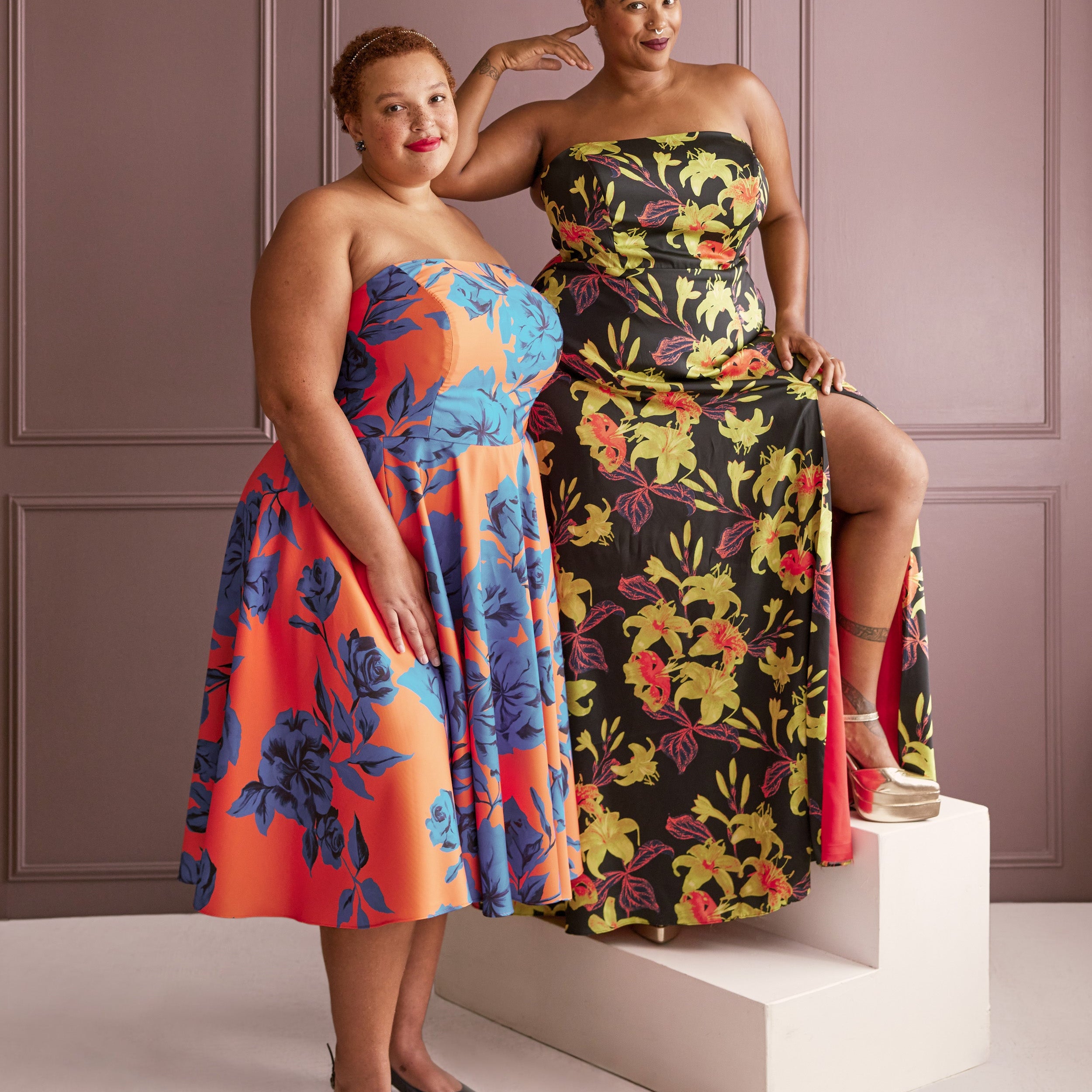Two women wearing floral strapless dresses against a plain background. This dress is the Ellington Strapless Dress sewing pattern from Cashmerette.