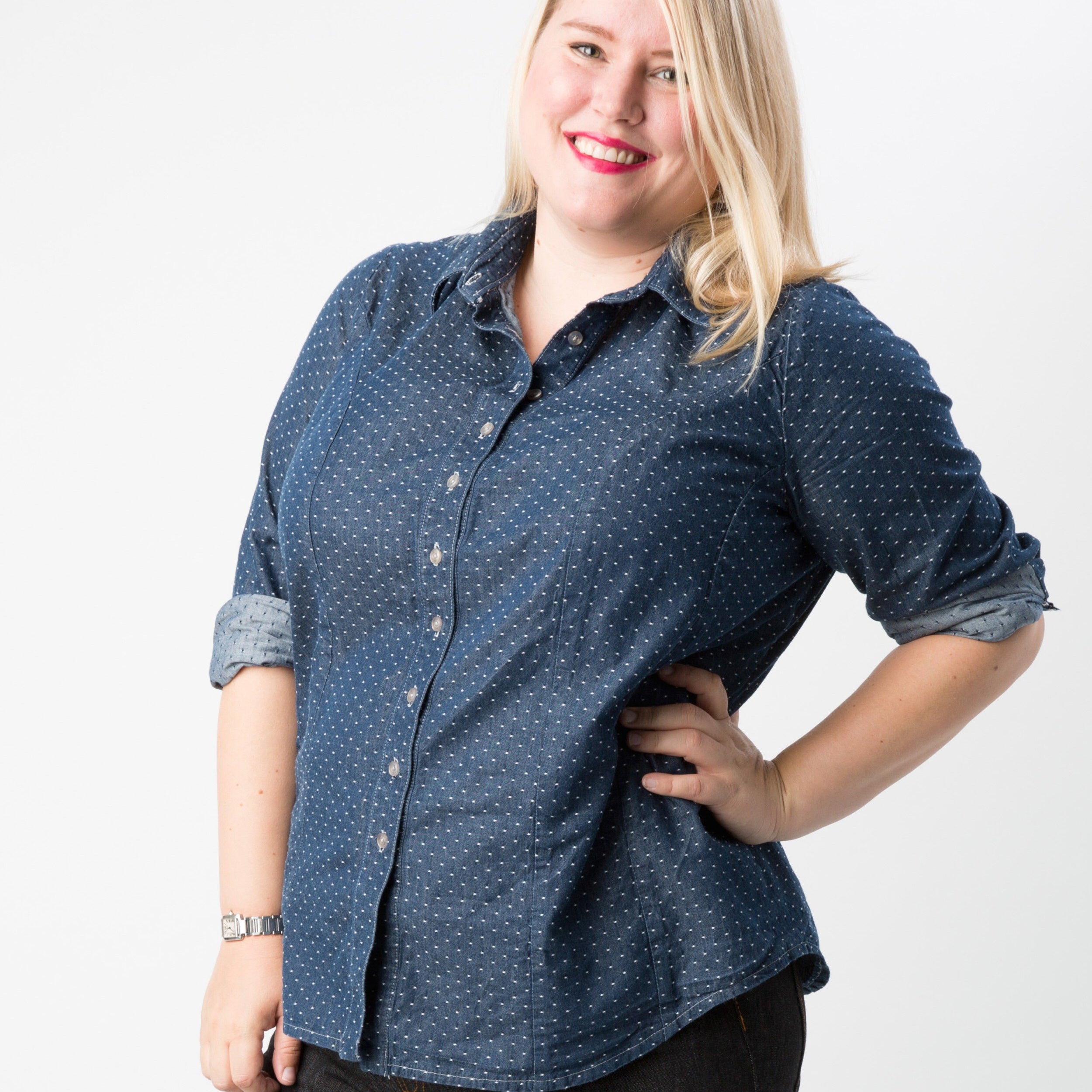 Woman wearing a blue patterned shirt on a white background. This button-up shirt is the Harrison Shirt sewing pattern from Cashmerette.