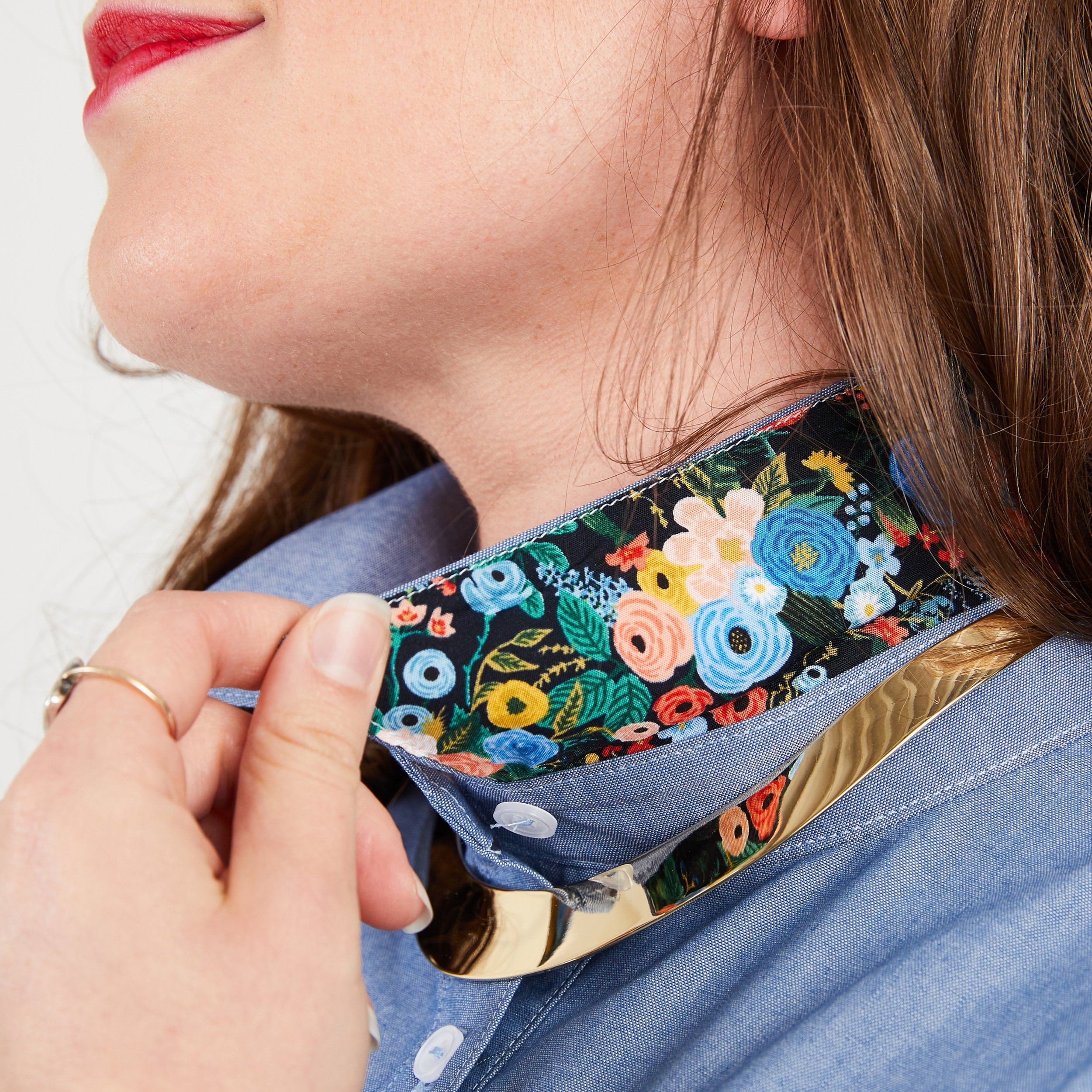 Person wearing a floral-patterned choker on a plain background. This button-up shirt is the Harrison Shirt sewing pattern from Cashmerette.