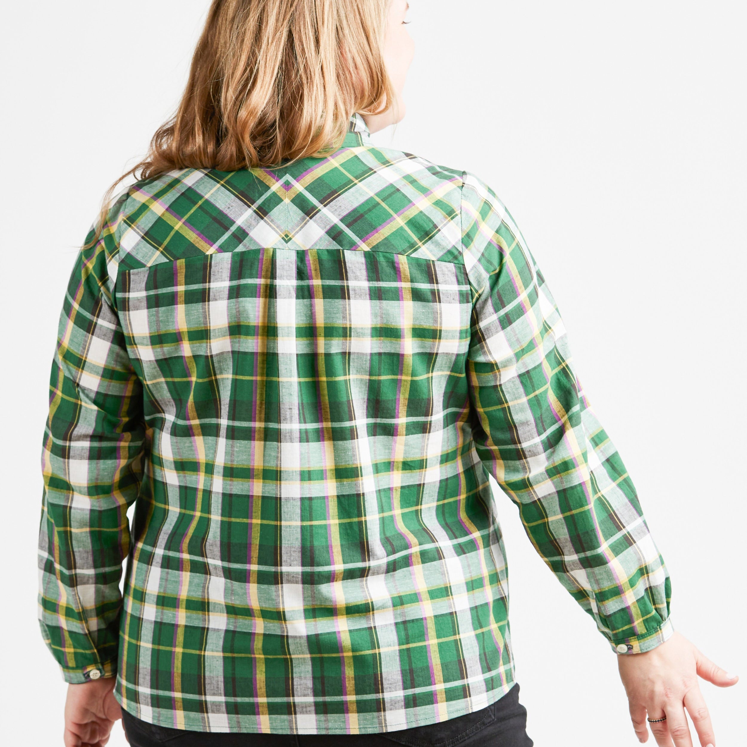 Person wearing a green plaid shirt on a white background. This top is the Vernon Shirt sewing pattern from Cashmerette.