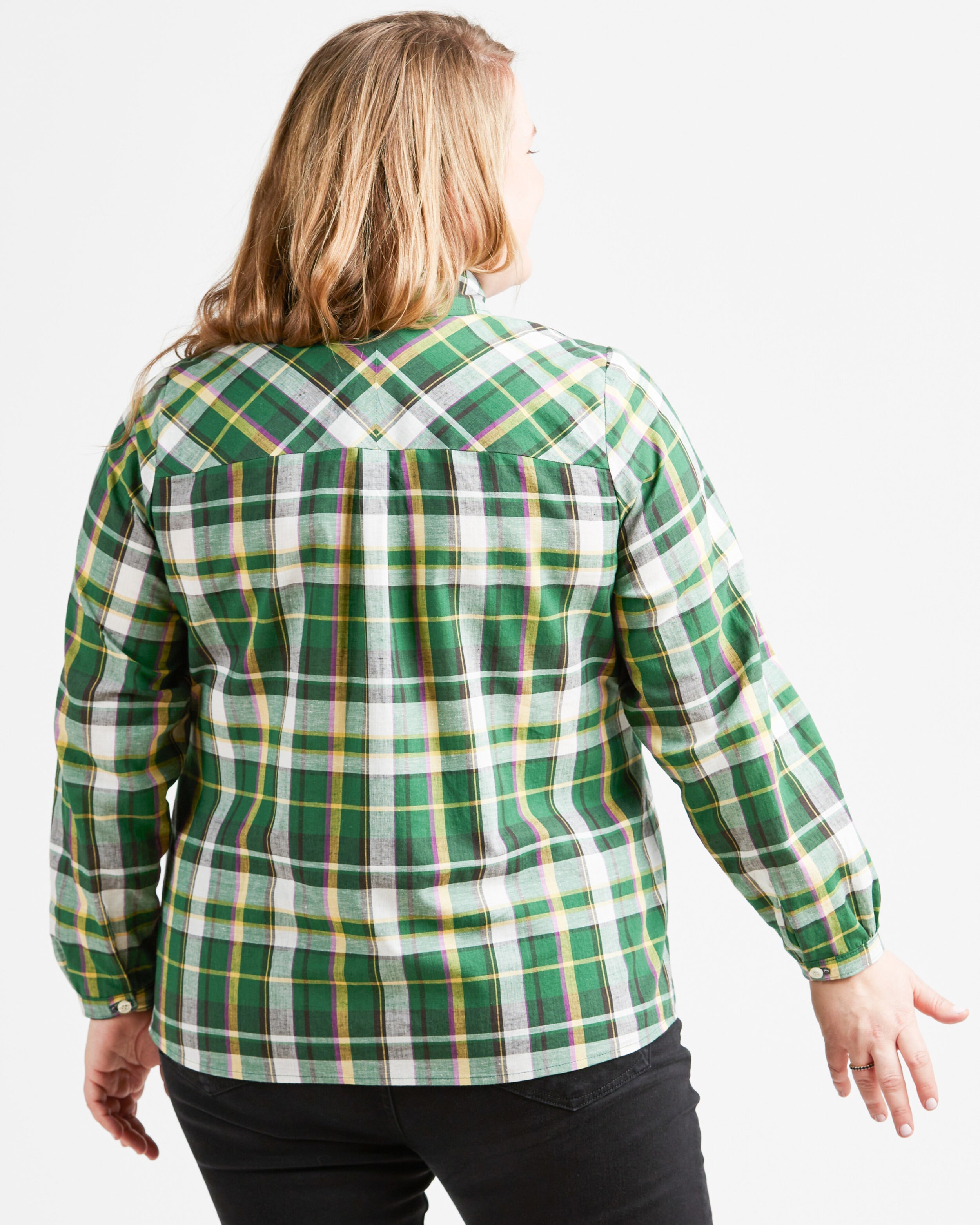 Person wearing a green plaid shirt on a white background. This top is the Vernon Shirt sewing pattern from Cashmerette.