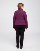 Person wearing a purple quilted jacket on a white background. This biker jacket is the Canton Moto Jacket sewing pattern from Cashmerette.