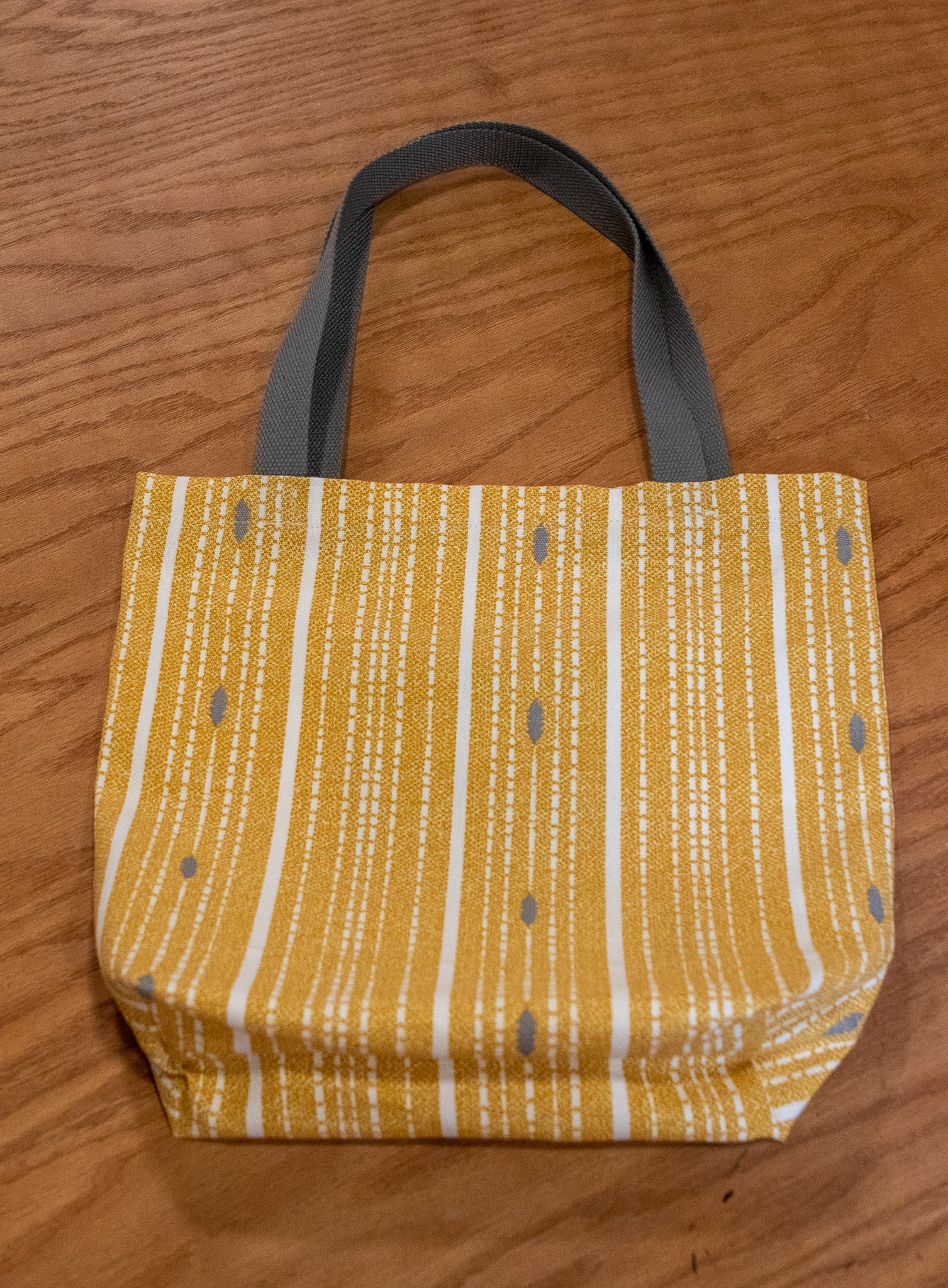 Image of yellow Rivet Patterns Forte Tote Bag flat lay