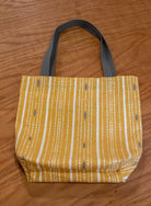 Image of yellow Rivet Patterns Forte Tote Bag flat lay