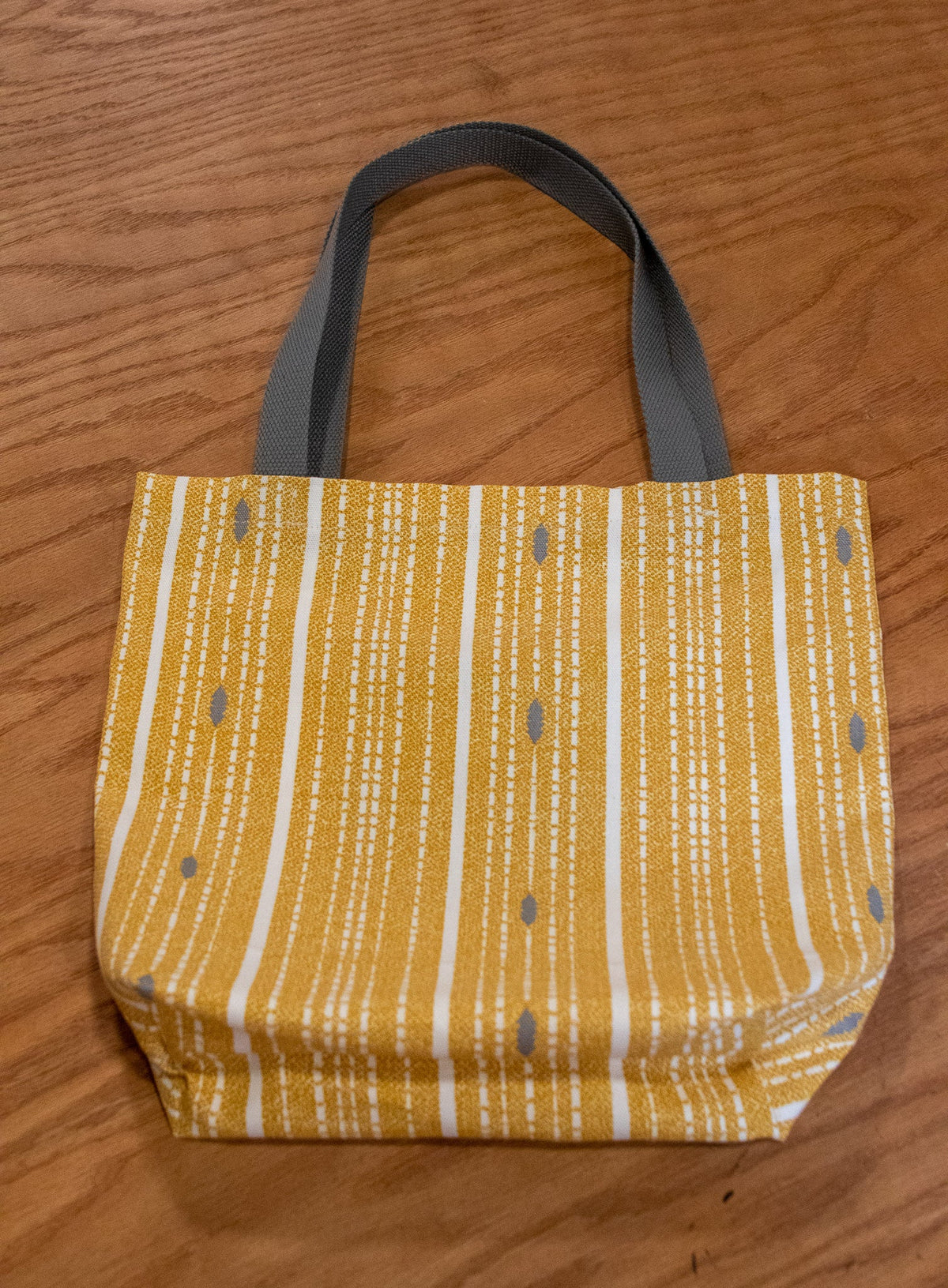 Image of yellow Rivet Patterns Forte Tote Bag flat lay