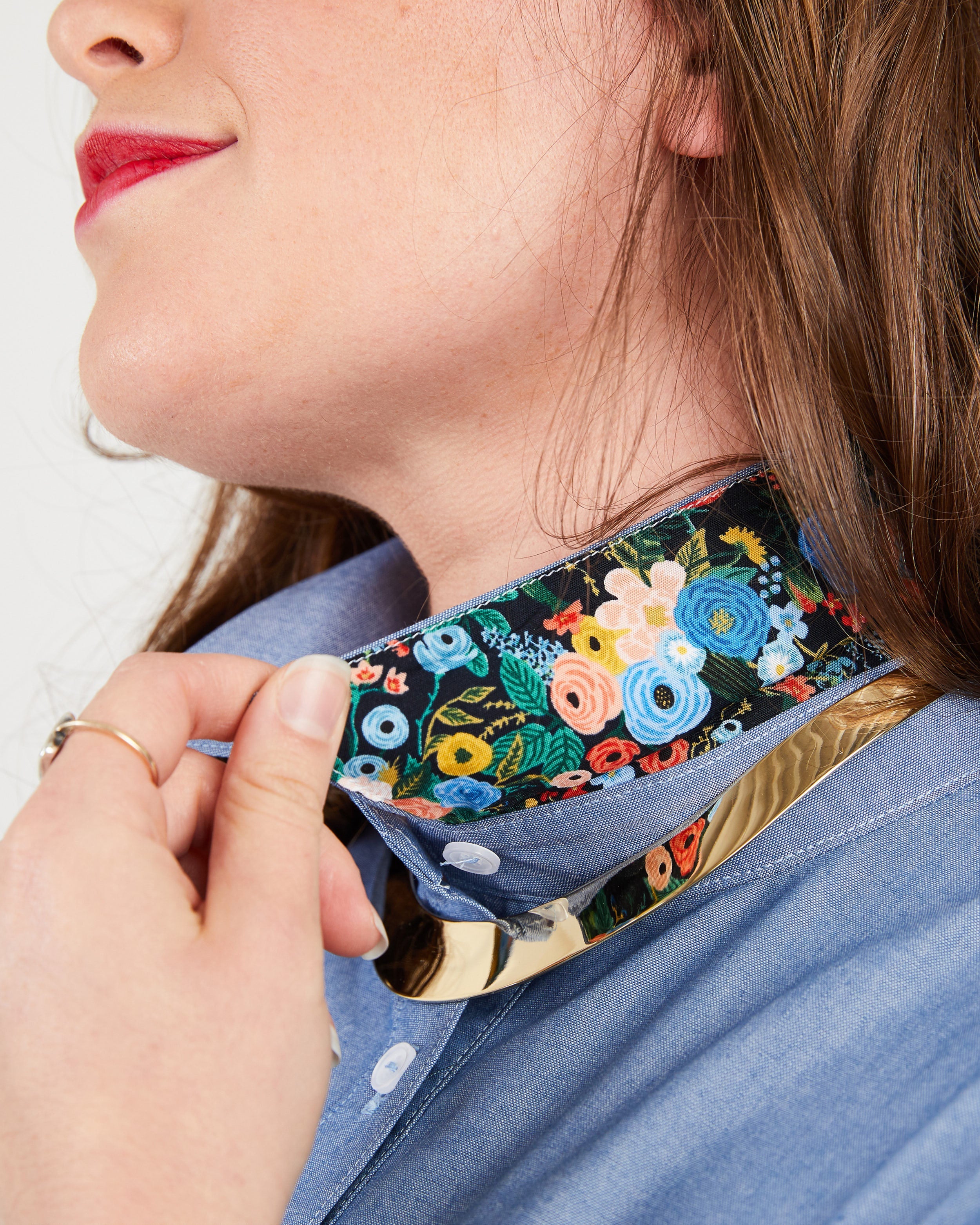 Person wearing a floral-patterned choker on a plain background. This button-up shirt is the Harrison Shirt sewing pattern from Cashmerette.
