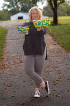 Image of yellow and blue Rivet Patterns Prelude Pouch being held